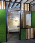 Wood block and green grass wall panels with swing glass door #0271