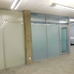 Privacy glass frosted full height wall system in University classroom application #0389