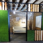 Office with black aluminum wall trim and clear glass swing door #0439