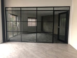 Glass wall with multiple transoms and black aluminum frame finish #1534