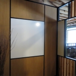 Integrated whiteboard wall with black wall trim and glazing bead #0434