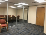 Glass conference room with swing doors - financial institution installation #1171