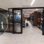 glass store front demountable walls with black frame finish - Flex Series NxtWall