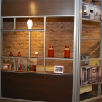 Office with sliding aluminum framed door and open shelf wall #0439