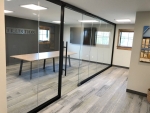All glass conference room with black wall frame finish #1647