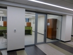 Glass office fronts - butt jointed glass solution with aluminum framed door #0283