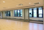 Glass seamless multi-purpose room with hardwood flooring View series interior walls #0301