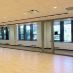 Glass seamless multi-purpose room with hardwood flooring View series interior walls #0301