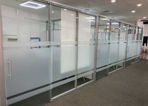 Flex Series freestanding glass offices with sliding frameless glass doors